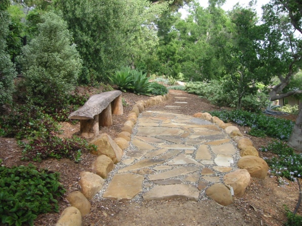 formerly grass, now log bench and small terrace along upper level path